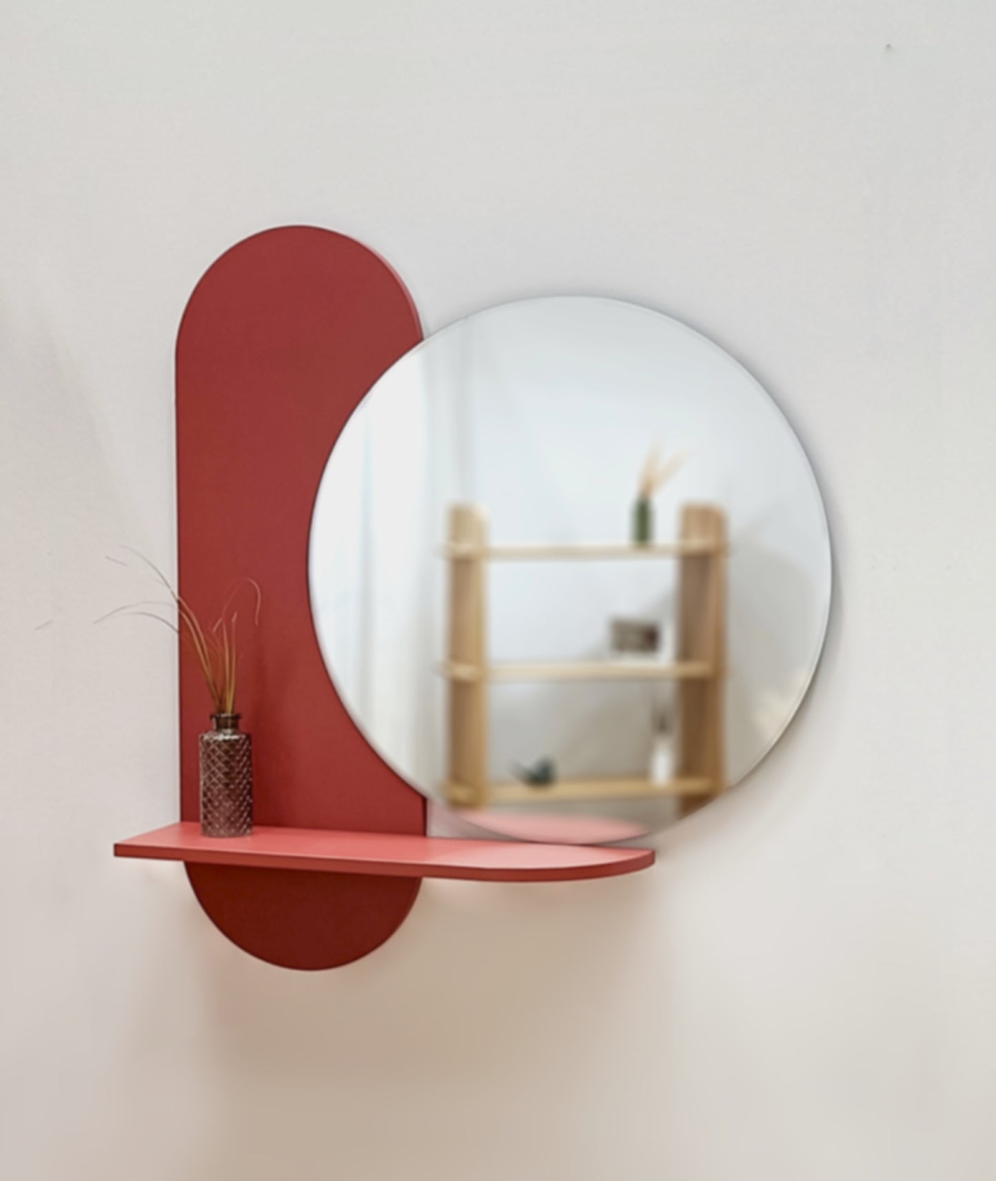 Red round wall mirror