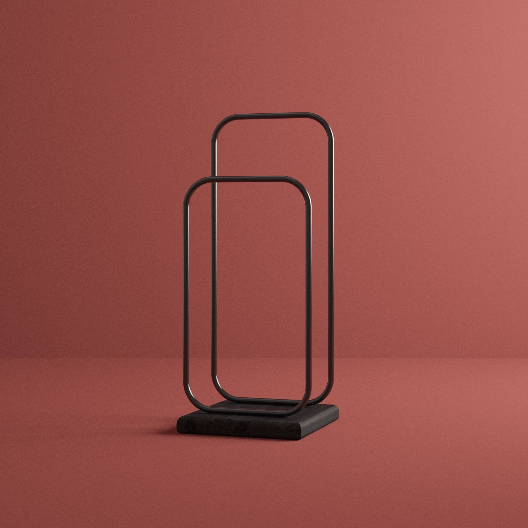 Modern black valet stand on burgundy background