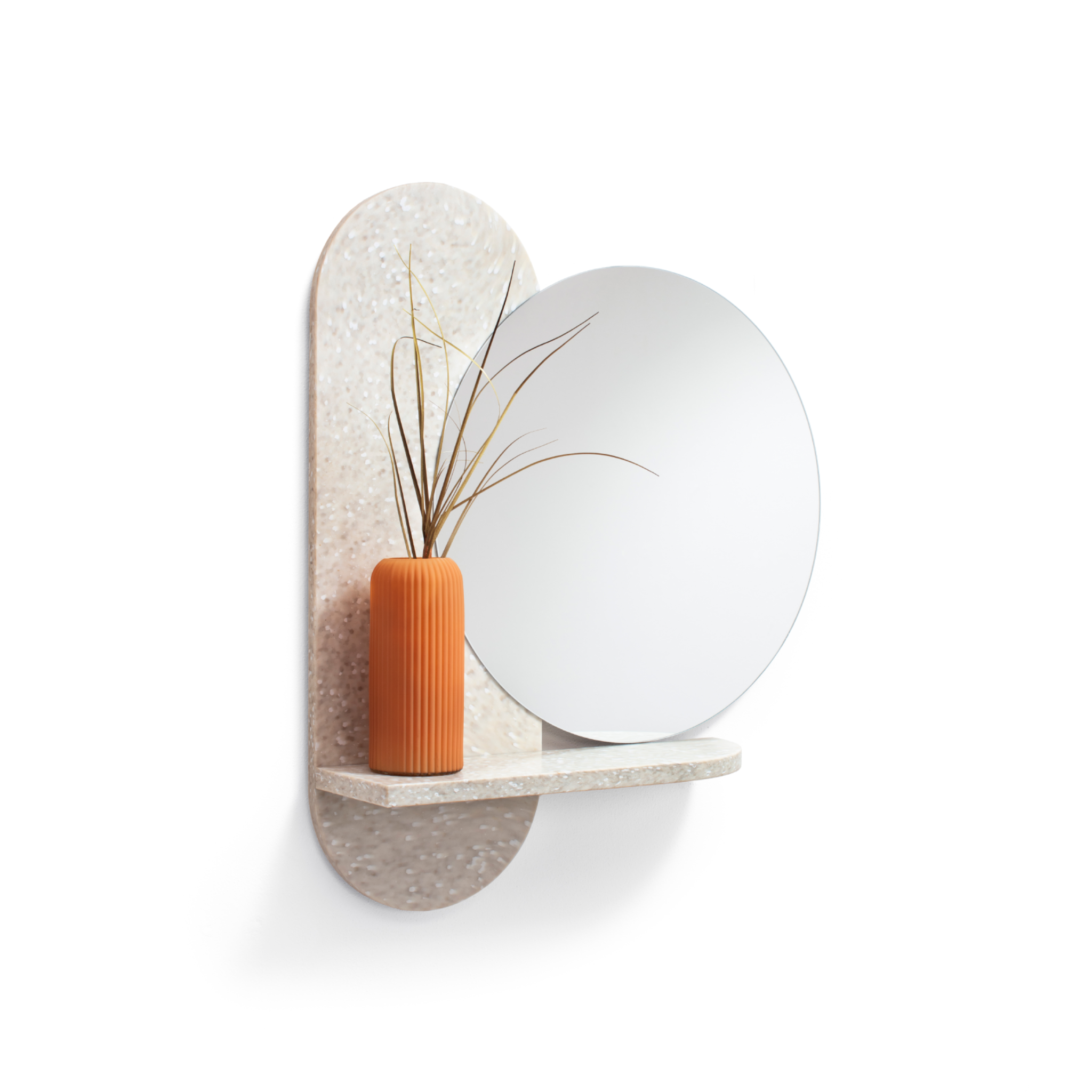 side view of round mirror from recycled plastic with a orange vase on integrated shelf